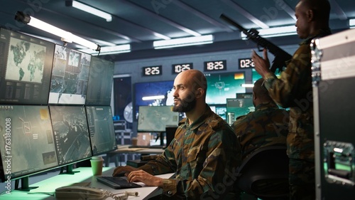 Slika na platnu Military agent working in control room, analyzing aerial reconnaissance data