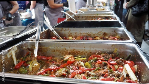 Tablou pe pânză Fried vegetables with dakgalbi meat are in a metal container