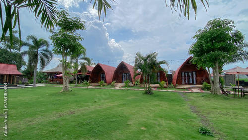 Tropical Unique Villa with Funnel Design, Surrounded by Greenery and a Clean Pool with Garden Seats. 