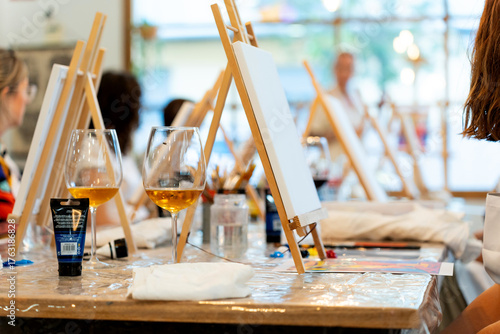 Fototapeta Naklejka Na Ścianę i Meble -  Art & Wine workshop. People enjoying paint and sip art workshop