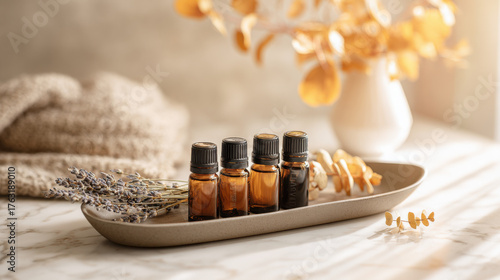 Essential oil bottles with lavender and decorative elements on a marble surface. This image showcases a serene spa-like setting with essential oil bottles and natural elements for relaxation