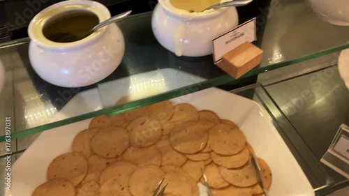 Criossants, jam, and cakes in a restaurant. Typical breakfast.