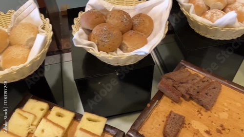 Criossants, jam, and cakes in a restaurant. Typical breakfast.