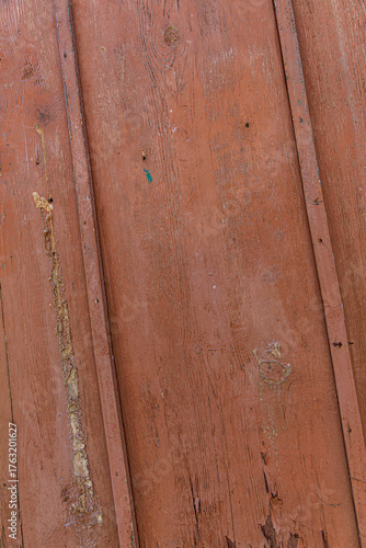 Close up of rustic brown wooden texture featuring detailed grain patterns and natural imperfections. Ideal for backgrounds, design elements, or vintage decorative surfaces with organic character.