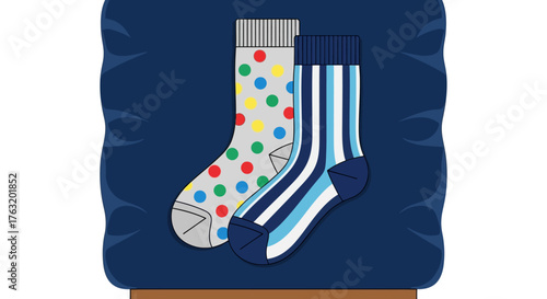 Two colorful pairs of socks featuring polka dots and stripes displayed on a textured fabric surface with a subtle gradient background for fashion and apparel concepts isolated on white background