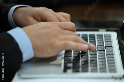 typing on laptop