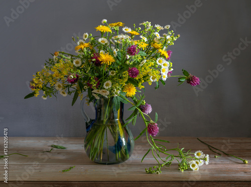 Still life with a magnificent bouquet of meadow flowers.