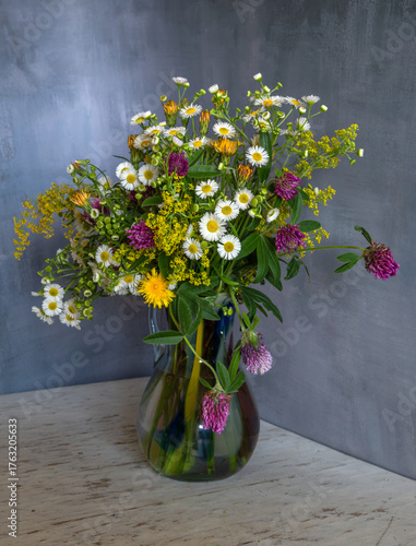 Still life with a magnificent bouquet of meadow flowers.