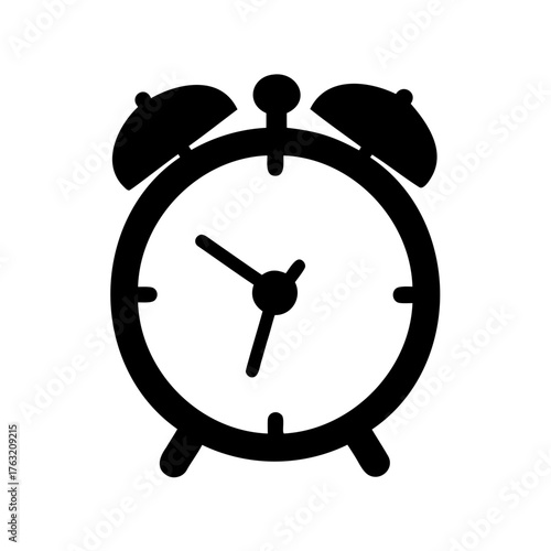 Silhouette of a vintage alarm clock with bell ringers and clock face