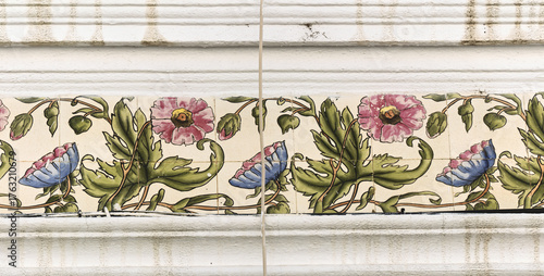 detail of an art nouveau azulejos frieze on a house in Olhao, Faro district, Algarve, Portugal	
