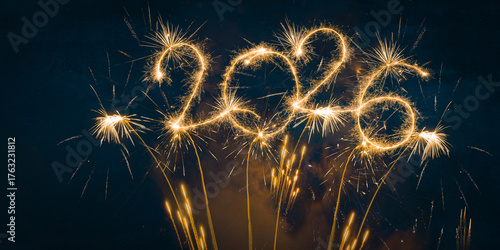 happy new year, new year's eve, silvester, new years eve, sparklers celebration greeting card, new year card - Year 2026 in sparkler font and firework fireworks pyrotechnic, blue night sky background