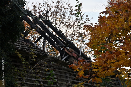 Ruins of a house from 1865 with collapsed roof and decayed structure
