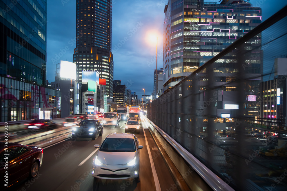 Obraz premium A night traffic jam on the city highway in Tokyo, Japan