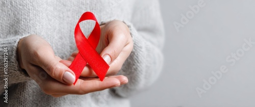 Aids Awareness: Woman Holding Red Ribbon Symbol