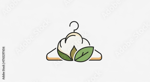 Cotton flower on a hanger, representing sustainable fashion, ecofriendly clothing, and natural textile industry