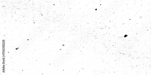 Subtle grunge texture featuring scattered dust, specks, and grime on a transparent background.
