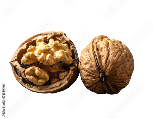 A cracked open nut next to its whole counterpart on a stark black background