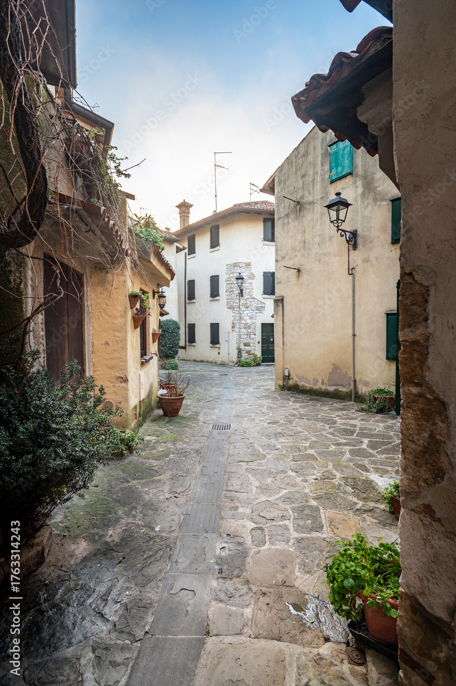 Fototapeta premium Between ancient history, art, and nature. The island of Grado in winter. The village and the sea. Friuli