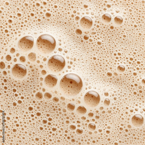 Close-up of Brown Foamy Liquid with Bubbles, Overhead Shot of Coffee or Beer Texture, Abstract