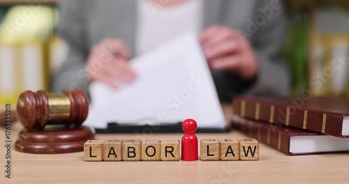 Exploring labor law in a modern office setting during a busy afternoon meeting with documents and legal symbols