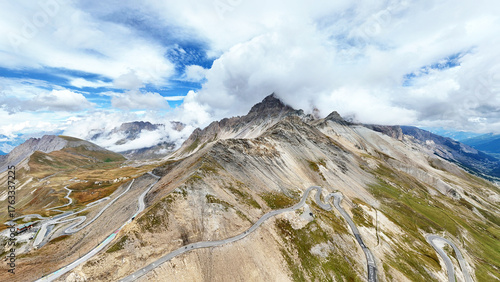 Alps mountain range with winding roads at Col du Galibier pass, Savoie, Auvergne-Rhone-Alpes, France, Europe.