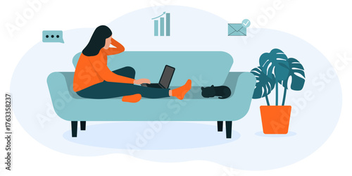 Woman sitting on sofa with laptop