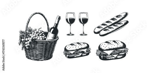 Picnic basket with wine, grapes, baguettes, and sandwiches
