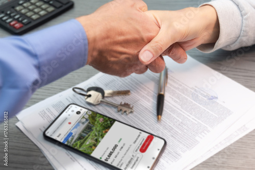 New home purchase agreement signed as keys are exchanged in a real estate transaction