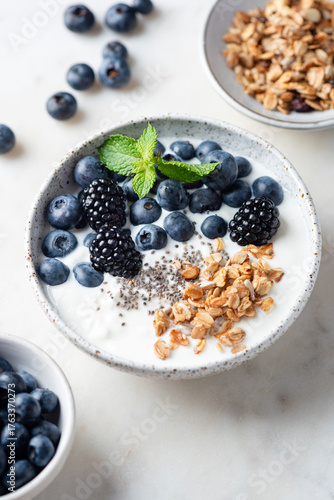 Superfood yogurt bowl with blueberries, blackberries, chia seeds and muesli