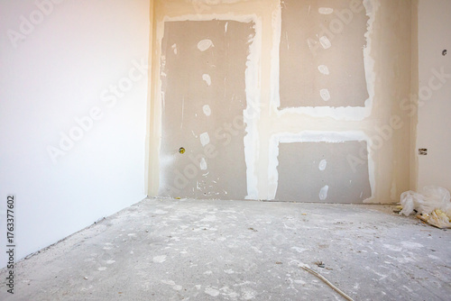 Assembled plasterboards on wall of an unfinished edifice on the building site