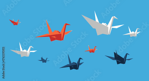 Origami Cranes Flying in a Blue Sky.