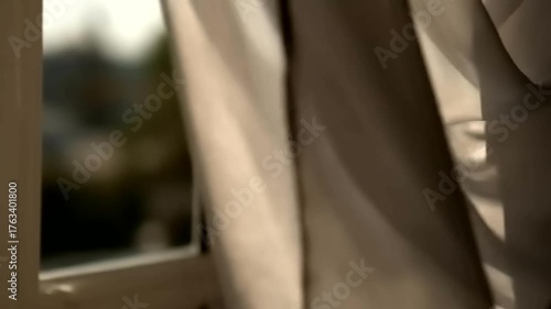 Soft Light and Shadow Play on a Flowing Curtain by the Window.