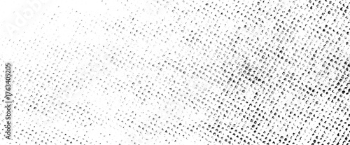 Worn halftone texture with uneven dot distribution and grunge effects on a transparent background.