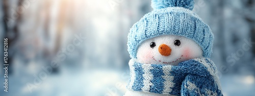Cute snowman in a blue knitted hat and scarf in a winter forest with copy space.