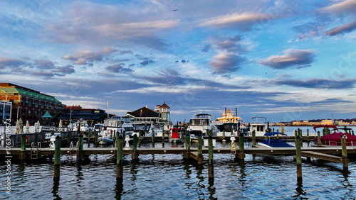 Marina at sunset in Old Town Alexandria Waterfront area with boats, docks, and tranquil water