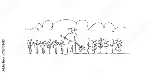 Farmer tending to crops in a field