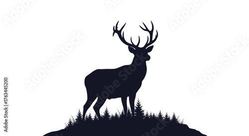 Silhouette of a majestic deer standing on a hill.