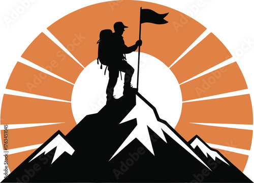 Silhouette of a mountaineer raising a flag on a mountain summit