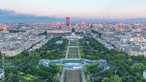 Fototapeta Naklejka Na Ścianę i Meble -  Aerial view of a large city skyline at sunset timelapse. Top view from the Eiffel tower. Paris, France.