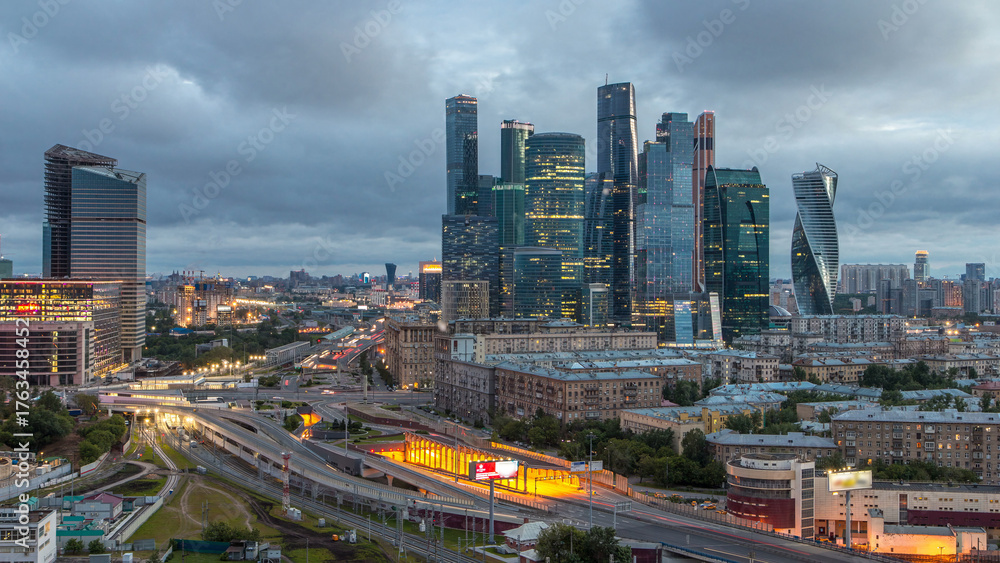 Fototapeta premium Night to day view of the city traffic timelapse and Building of Moscow International Business Center Moscow-City