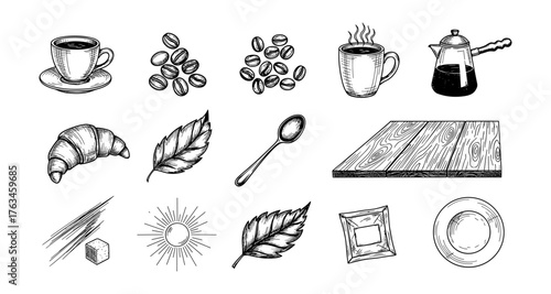 Hand drawn coffee elements with croissant and leaves on wooden table