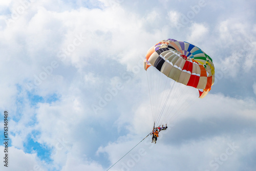 Patong Beach Phuket with parachute sport and parasailing activity Thailand.