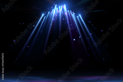 Blue light rays with sparks on black background