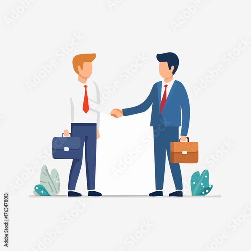 Two businessmen shaking hands, symbolizing a successful partnership and agreement.