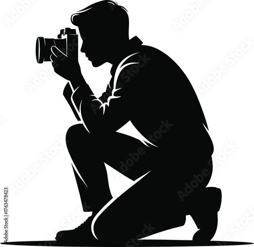 Crouching photographer capturing a moment in silhouette