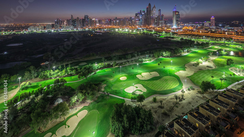 Photography Dubai Marina skyscrapers and golf course day to night timelapse, Dubai, United A
