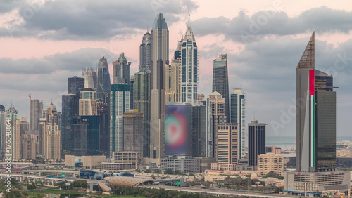 Dubai Marina skyscrapers and golf course night to day timelapse, Dubai, United Arab Emirates