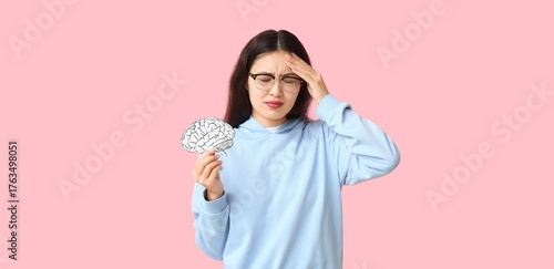 Young Asian woman with pape...