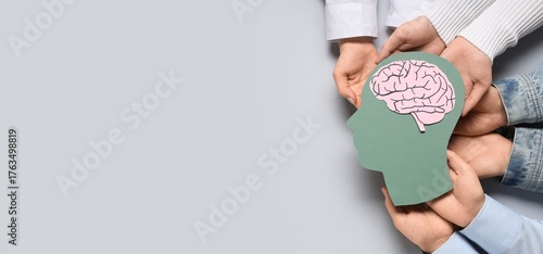 Many hands holding paper hu...