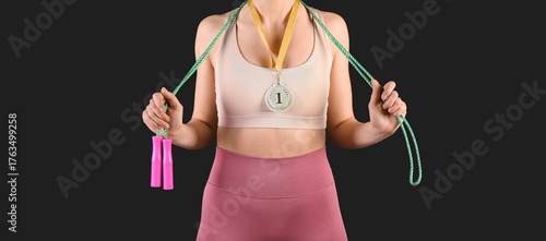 Sporty young woman with ski...